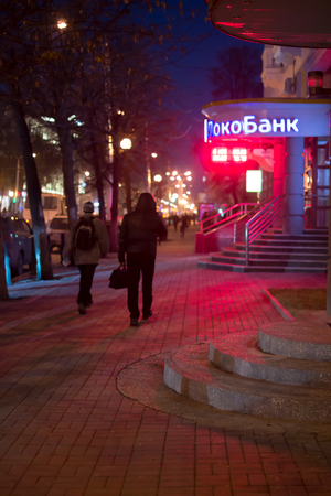 17/10 - People walking on a illuminated city street during a rain storm in Ufa, Russia in October 17th 2015のeditorial素材