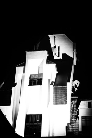 The strong contrasts between black and white in this image uses Chiaroscuro styles of stark lighting...