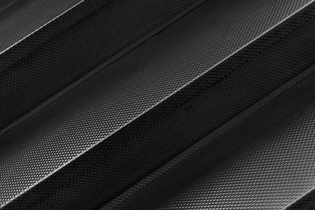 Aluminium metal texture steps for grunge style backgrounds or backdrops. Natural light effect on the...