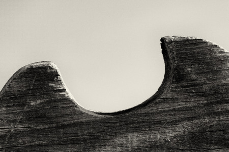Wave like effect from a wooden fence texture in black and white monochrome