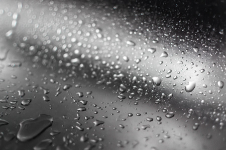 Condensation water droplets on a silver metallic chrome style surfaceの写真素材