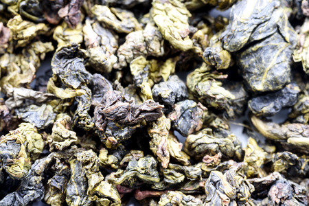 Closeup overhead image of loose tea leaves in a  compressed form.の写真素材