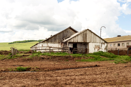 Rural farm buildings in Russia during the summer sunの写真素材