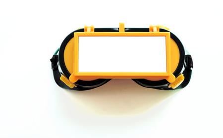Welders eye protection goggles with isolated glass for overlays and text for construction welding ideasの写真素材