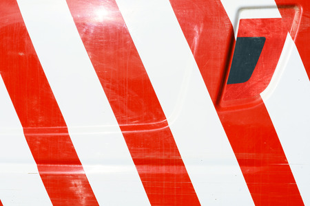 Red and white door markings for safety painted on a vehicle exteriorの写真素材