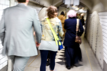 Intentional blurred motion blur of people using London Underground trains as the tube for public...