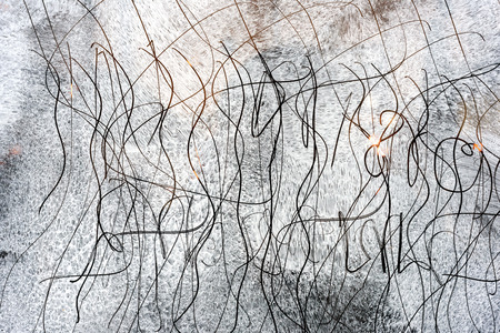 Unrecognised scratch marks on glass whitewash creating an abstract patternの写真素材
