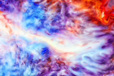 Abstract liquid milk flowing pattern like nebulae in the universe with different colours of white,...