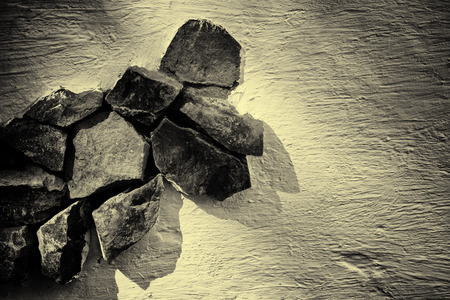 Sepia Vintage toned dry stone wall with details of the textures and patterns of the constructionの写真素材