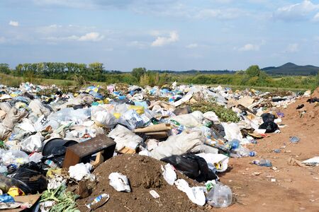 RAEVKA, RUSSIA - SEPTEMBER 9, 2018: A local rubbish tip full of waste that  awaits buria as part of the local landfill site for disposing of peoples household trash in Russialのeditorial素材