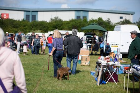 CHELMSFORD, ESSEX/ENGLAND - 1ST JUNE 2019 - People visiting a car boot sale in Boreham Essex where they can buy cheap and unusual items during the summer of 2019のeditorial素材