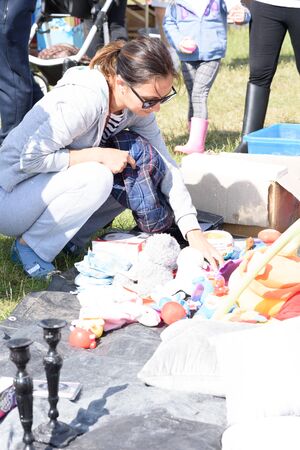 CHELMSFORD, ESSEX/ENGLAND - 1ST JUNE 2019 - People visiting a car boot sale in Boreham Essex where they can buy cheap and unusual items during the summer of 2019のeditorial素材