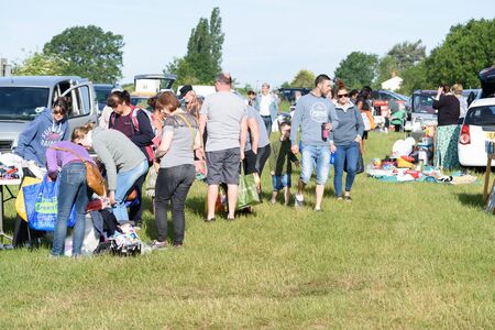 CHELMSFORD, ESSEX/ENGLAND - 1ST JUNE 2019 - People visiting a car boot sale in Boreham Essex where they can buy cheap and unusual items during the summer of 2019のeditorial素材