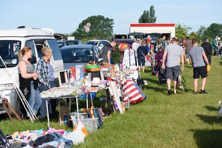 CHELMSFORD, ESSEX/ENGLAND - 1ST JUNE 2019 - People visiting a car boot sale in Boreham Essex where they can buy cheap and unusual items during the summer of 2019のeditorial素材