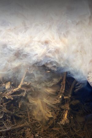 Mud and water merge together creating a pollution based theme of toxic liquid with dirt swirls in motionの写真素材