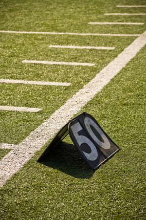 50 Yard Line Marker On Sidelines Of Football Field