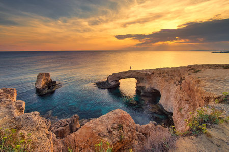 Sunset over the rocks of Ponta da Piedade, Algarve, Portugalの写真素材