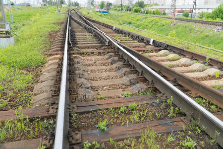 Rusty old rails in the city in nature.の写真素材