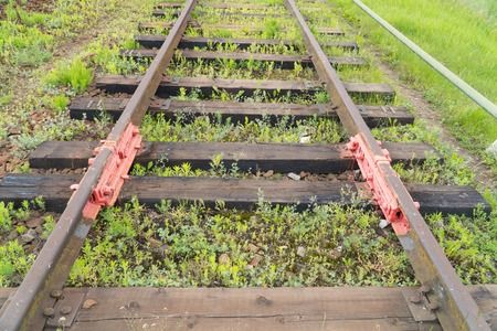 Rusty old rails in the city in nature.の写真素材