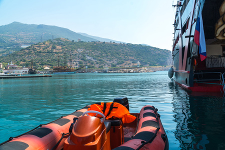 Inflatable motor boat in the background sailing ships at the pier, Turkey, Alanyaの写真素材