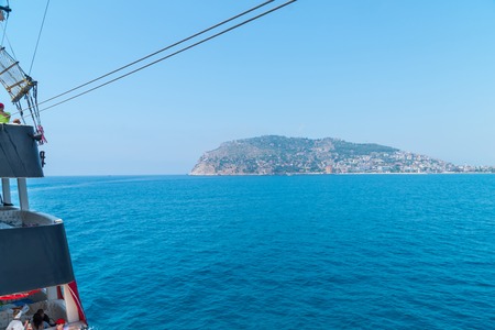 Cruise boats with tourists on Board, sailing along the magnificent scenic route along the Mediterranean coastの写真素材