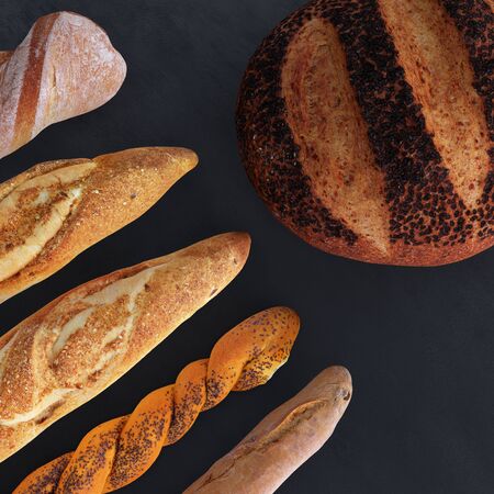Different types of bread and rolls in the top view. Kitchen or bakery poster design on dark.の写真素材