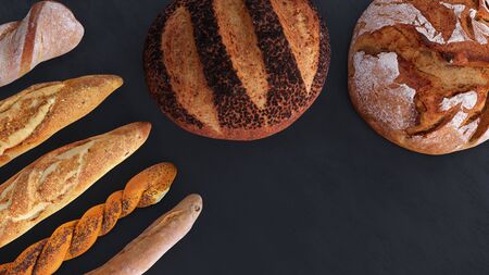 Different types of bread and rolls in the top view. Kitchen or bakery poster design on dark.の写真素材