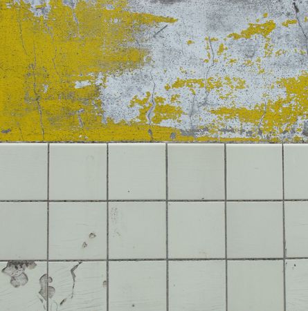 worn white and yellow paint,rows of white tiles                                     の写真素材