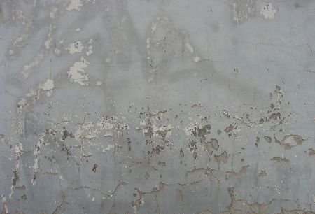 worn beige gray  painted wall with paint chip and remains of tag                                 の写真素材