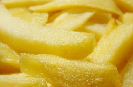 yellow gold french fries that had their first bake                             の写真素材