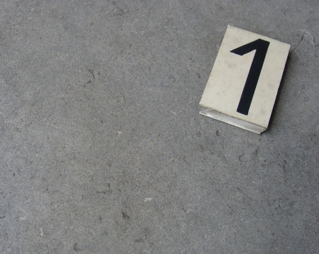 plastic 1 one number on gray stone surface                               の写真素材