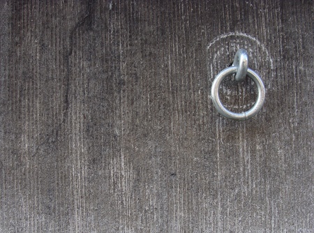 metal ring attached to a stone grunge wall                                                              の写真素材