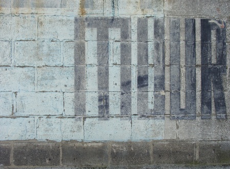 the word muur , meaning wall in dutch painted in black                               の写真素材