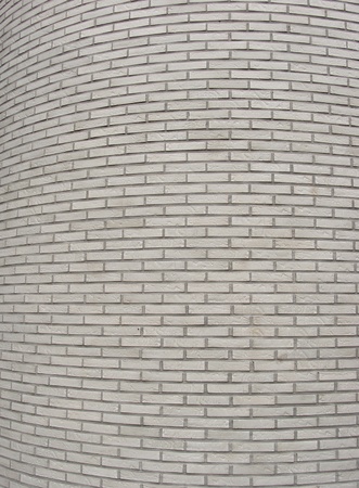rounded corner of a large white tiled wallの写真素材