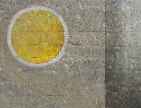 abstract circle sun like shape  in yellow on grunge backgroundの写真素材