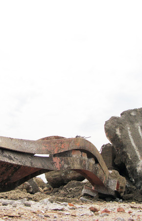 stone and twisted metal on a demolition siteの写真素材