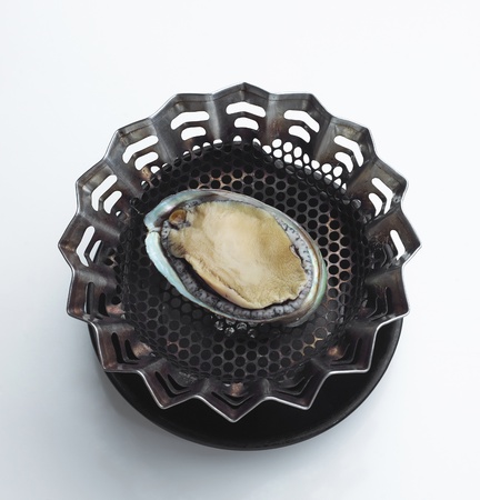 Cooking fresh oyster Japanese species on the unique grill stove 