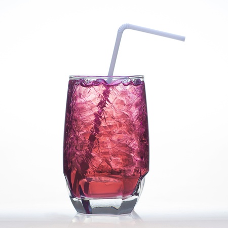 Grape flavor soft drinks whit soda water isolated on whiteの写真素材