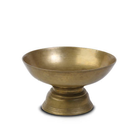 Ancient brass bowl for special ceremony isolated on white background の写真素材