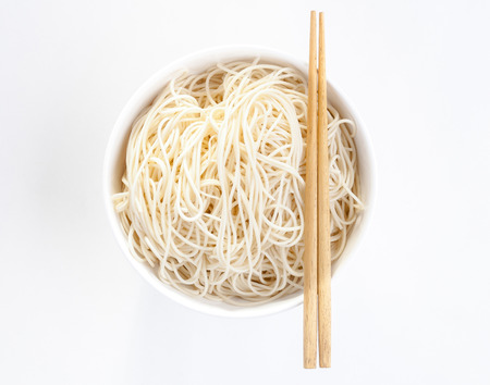 Chinese noodle style with chopsticks isolated on white backgroundの写真素材