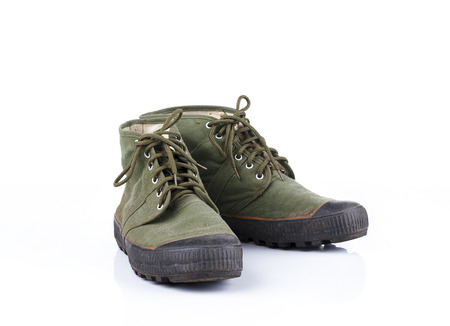 Old hiking shoe isolated on white backgroundの写真素材