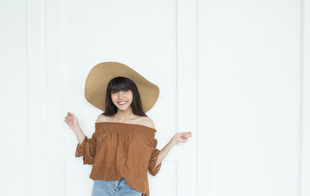 Young beautiful girl smiling and relaxing in front of the backgroundの写真素材