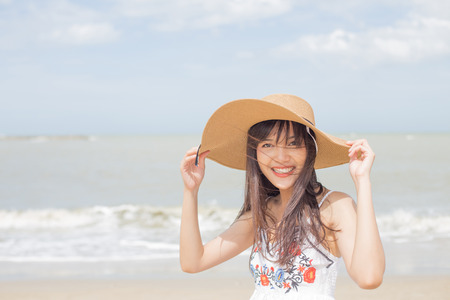 Thai girl enjoy and happy her relaxing on the beach, Hua Hin, Thailandの写真素材