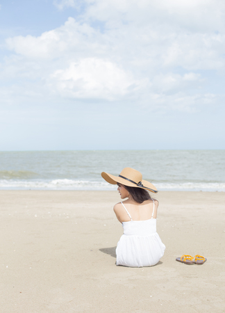 Young girl enjoy and happy her relaxing on the beach, Hua Hin, Thailandの写真素材