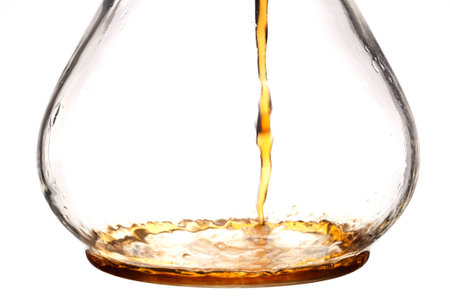 Coffee pouring into a glass coffee maker の写真素材