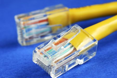 Close-up view of the yellow cable isolated on blue