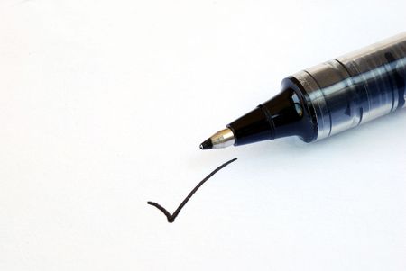 Write the tick on the white paperの写真素材