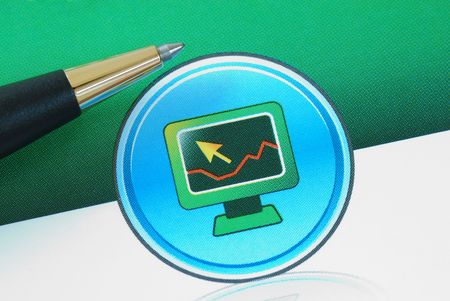 A computer with a graph concepts of trading and analysisの写真素材