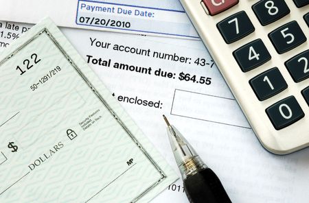Write a check to pay the bills on timeの写真素材