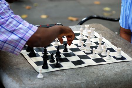 Two men playing chess in a parkの写真素材
